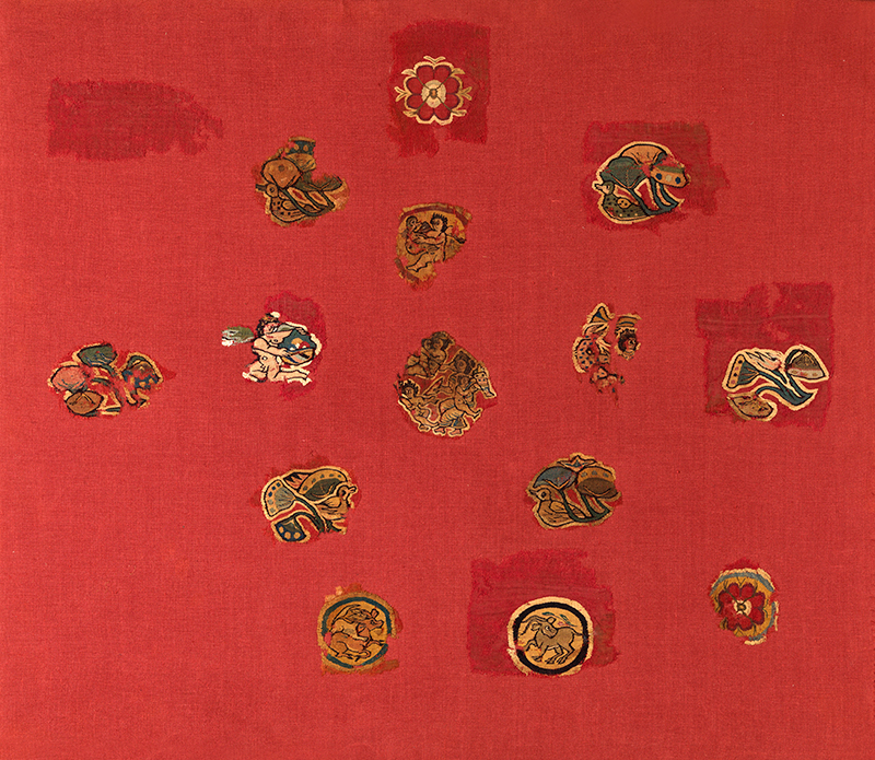 Antinoe, Egypt, Fragments from the Shawl of Sabina: Nile and rural scenes with Cupids, ducks, boars and flowers. Red woollen cloth with woven decoration in wool and linen Acquisition, 2014 E 33148